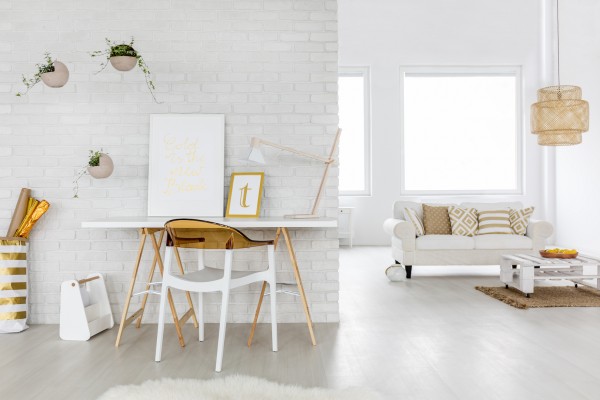 Spacious living room interior with couch and desk